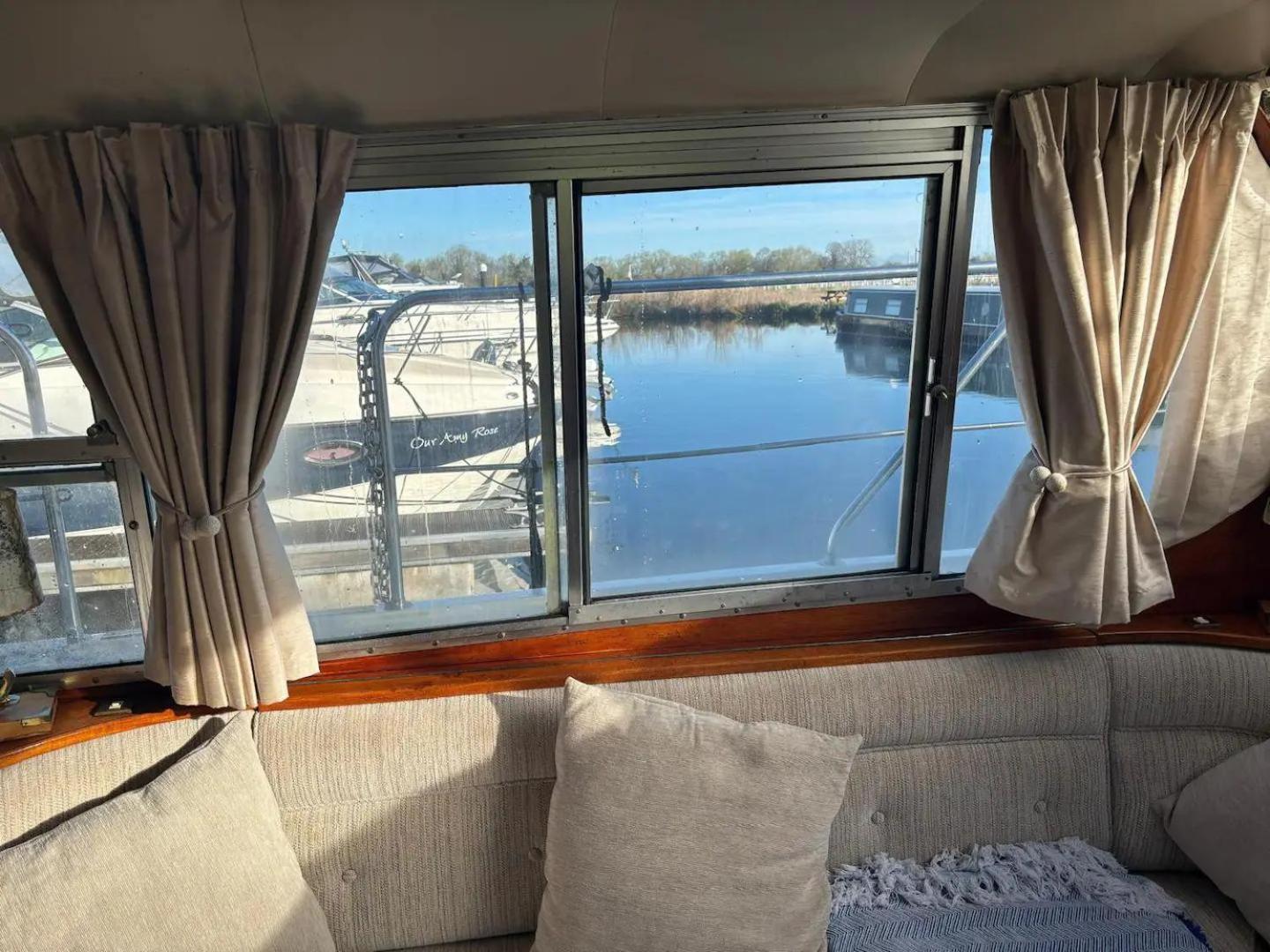 Riverside Boat Retreat On The River Thames *